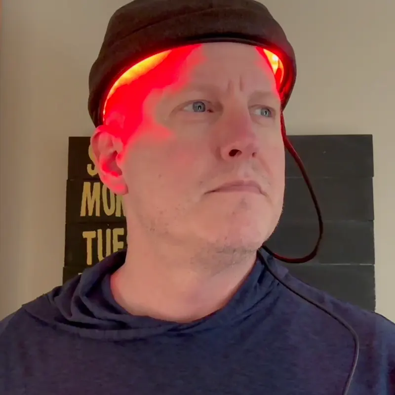 Glokore customer wearing the hair regrowth cap during a session